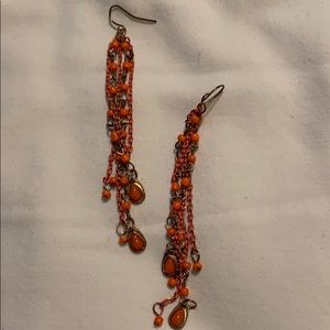 Orange and gold colored necklace and earrings